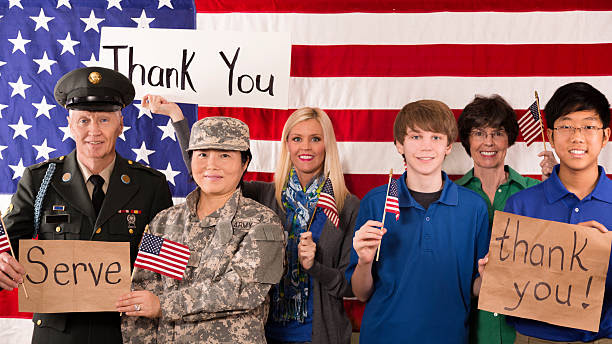 military:  group of people show appreciation for american veterans. - veteran stock pictures, royalty-free photos & images