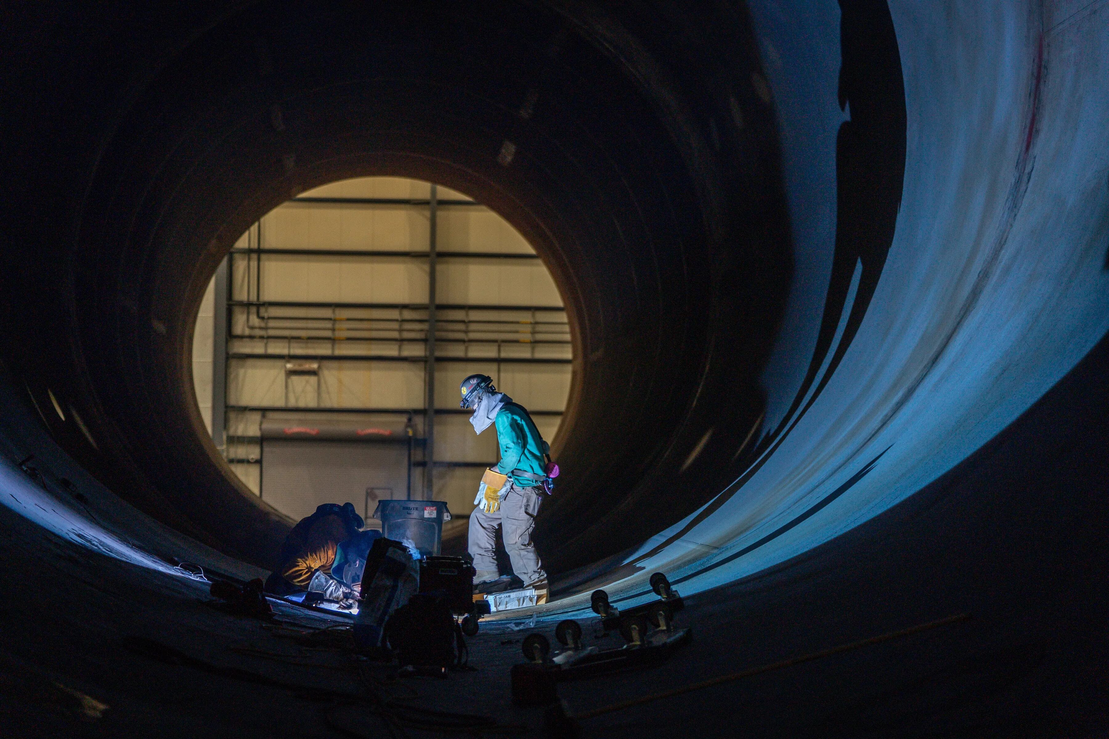 Welders work on a monopile foundation at EEW AOS in Paulsboro, Gloucester County. The monopiles are one piece of the offshore wind turbines slated to be erected in New Jersey. 