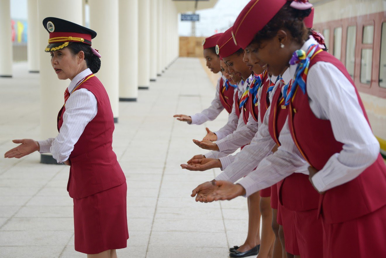 A Chinese rail conductor trains Ethiopian attendants at a railway station in Ethiopia in 2016. China built a railway linking the Ethiopian capital of Addis Ababa and the port of Djibouti as part of the Belt and Road Initiative.