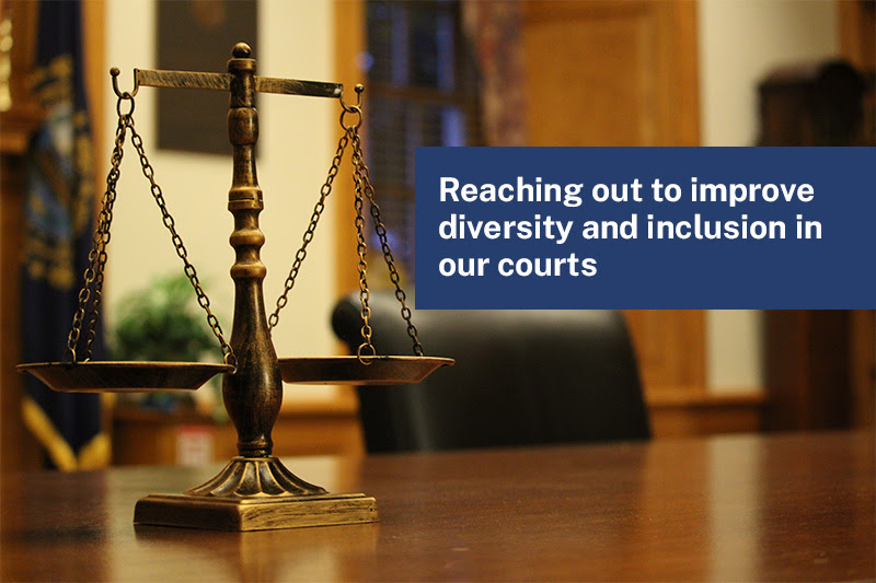 Balanced scales on a table with a text overlay that says: Reaching out to improve diversity and inclusion in our courts