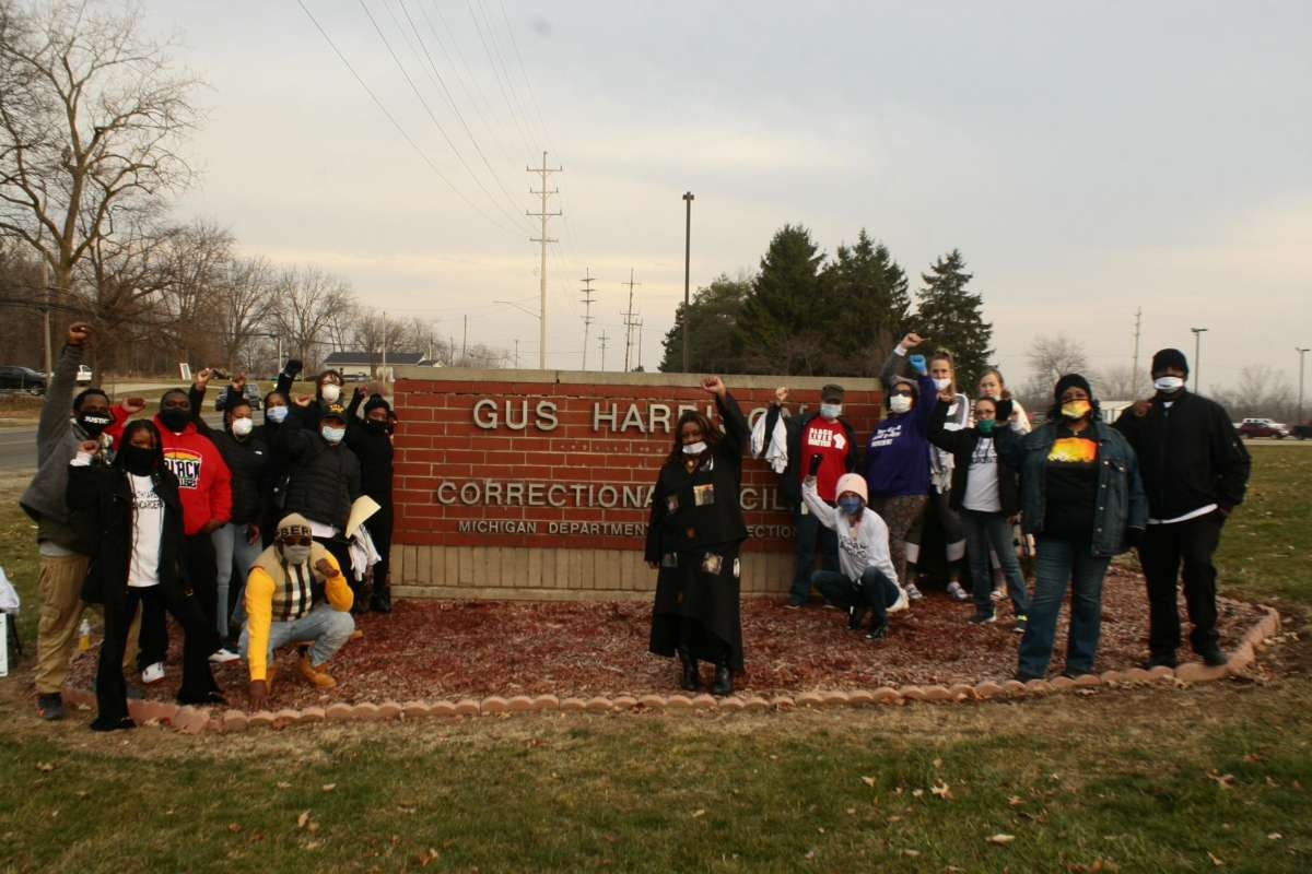 Residents of Adrian, Michigan, join family members and advocates demand the release of aging and medically vulnerable people on December 11, 2020.