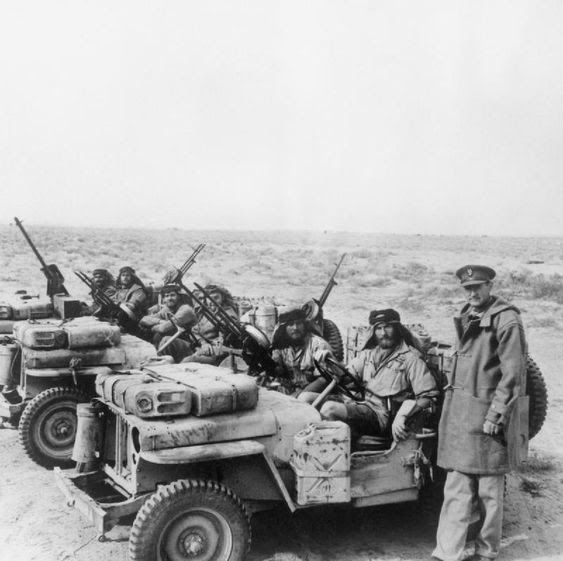 A Special Air Service jeep patrol is greeted by its          commander, Colonel David Stirling, on its return from the          desert. 18 January 1943.