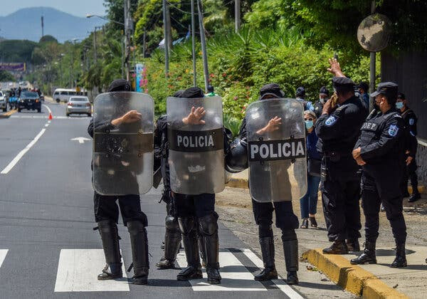 Riot police officers outside the house of the opposition presidential candidate Cristiana Chamorro Barrios in 2021, after she was arrested. Ms. Chamorro was among those released on Thursday and who are flying to Washington.