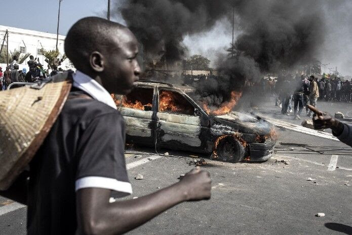 Lors d'une manifestation, à Dakar, le 8 mars 2021. | John Wessels / AFP