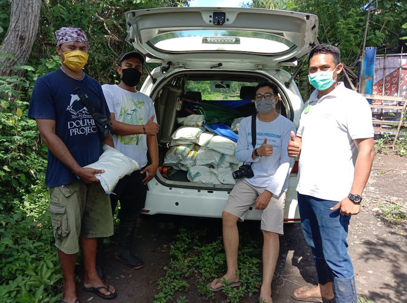 Our team helps to distribute masks and food to local villagers in need, Bali, Indonesia