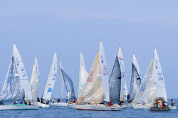 J/24s sailing off Cala Galera, Italy