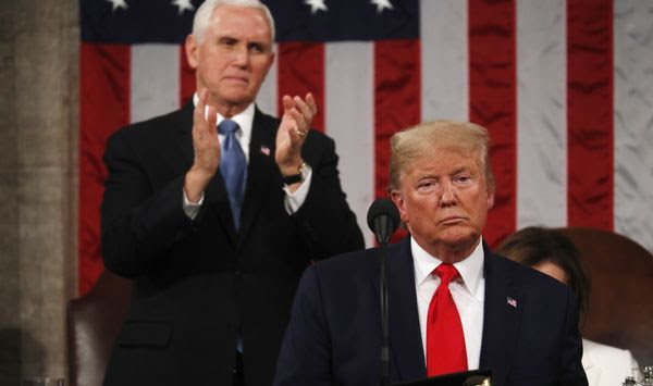 President Donald Trump delivers his State of the Union address to a joint session of Congress in the House Chamber on Capitol Hill in Washington, Tuesday, Feb. 4, 2020, as Vice President Mike Pence applauds. (Leah Millis/Pool via AP)