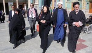 Iran: As women die for freedom not to wear hijab, Swiss envoy wears long black veil in visit to Shia shrine