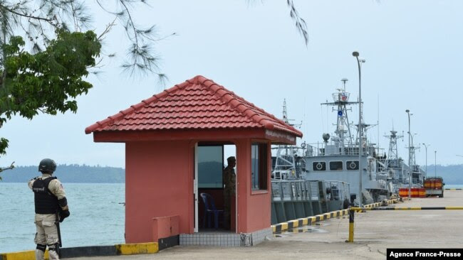FILE - Cambodian navy personnel guard a jetty at Ream Naval Base in Preah Sihanouk province during a government organized media tour, July 26, 2019.
