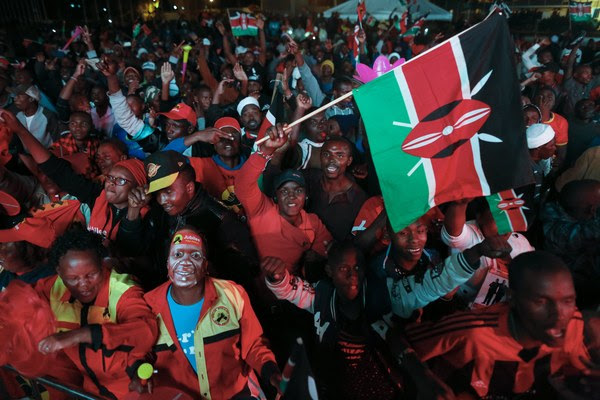 Supporters of President Uhuru Kenyatta cheer in Nairobi after he was declared the winner of Kenya's&nbsp;presidential election on Aug. 11. (Dai Kurokawa/European Pressphoto Agency)</p>

