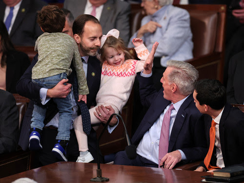 WASHINGTON, DC - JANUARY 07: U.S. House Republican Leader Kevin McCarthy (R-CA) greets Rep.-elect Lance Gooden (R-TX) and his children Milla and Liam in the House Chamber during the fourth day of elections for Speaker of the House at the U.S. Capitol Building on January 07, 2023 in Washington, DC. The House of Representatives is meeting to vote for the next Speaker after House Republican Leader
 Kevin McCarthy (R-CA) failed to earn more than 218 votes on several ballots; the first time in 100 years that the Speaker was not elected on the first ballot.
