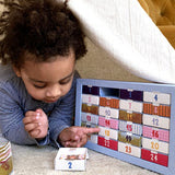 Child plays with PLAYin CHOC plastic-free advent calendar
