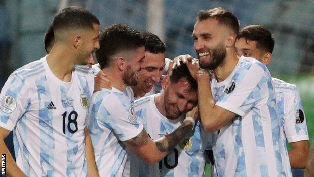 Lionel Messi is congratulated by team-mates after scoring against Ecuador