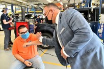 Angel Sarabia, shares an elbow bump with Education Secretary Miguel Cardona, .