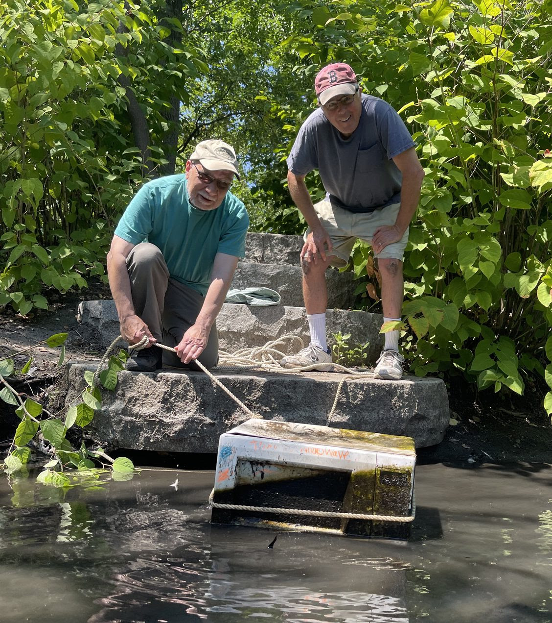 Save the Alewife Brook's David White and David Stoff reel in the Alewife's 