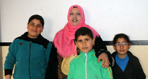 Samirah 'Abd a-Dayem with her children. Photo by Muhammad Sabah, B'Tselem, 27 Feb. 2017