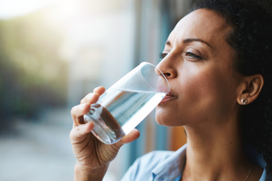 Stock image of woman drinking water
