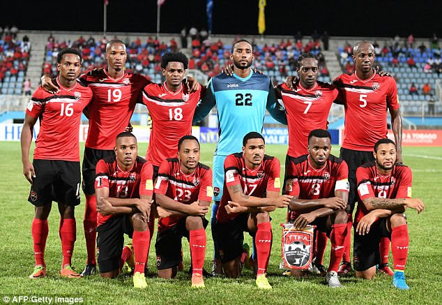 Players of Trinidad and Tobago pose for pictures before the start of their 2018 World Cup qualifier football match against the United States, in Couva, Trinidad and Tobago