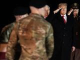 President Donald Trump salutes as a U.S. Army carry team moves a transfer case containing the remains of Sgt. 1st Class Javier Gutierrez, of San Antonio, Texas, Monday, Feb. 10, 2020, at Dover Air Force Base, Del. According to the Department of Defense both Gutierrez and Sgt. 1st Class Antonio Rodriguez, of Las Cruces, N.M., died Saturday, Feb. 8, during combat operations in Afghanistan. (AP Photo/Evan Vucci)