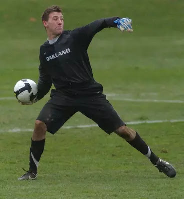 Oakland goalkeeper Steve Clark throws a ball down fiel