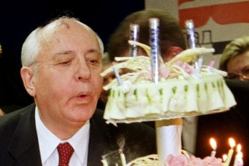 Former Soviet leader Mikhail Gorbachev blows on candles during a ceremony ahead of his 70th birthday in Moscow, February 2001 (Image: Reuters File)
