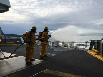 Photo of vessel crews doing firefighting training