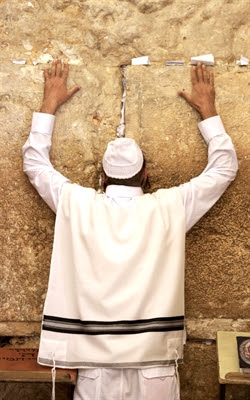 Jewish man prays at the Kotel