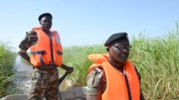 Cameroonian soldiers patrol Lake Chad on March 1, 2013 near Darak close to the Nigerian border.