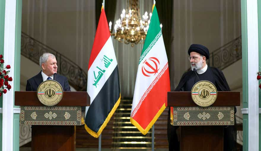 Iran's President Ebrahim Raisi (R) and his Iraqi counterpart Abdul Latif Rashid during a joint press conference in Tehran, April 29.
