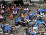 In this May 6, 2021, file photo, Maricopa County ballots cast in the 2020 general election are examined and recounted by contractors working for Florida-based company, Cyber Ninjas, at Veterans Memorial Coliseum in Phoenix. (AP Photo/Matt York, Pool, File)