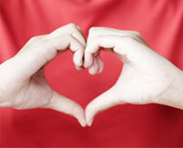 image of person making heart shape with hands