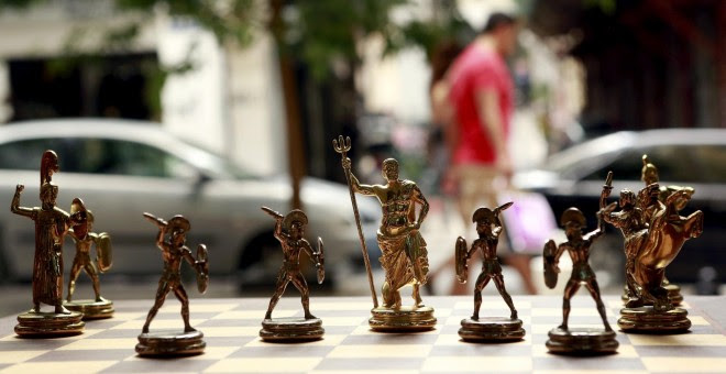 Chess pieces depicting Greek gods and Spartan soldiers on display in a shop in Athens, Greece July 11, 2015. Skeptical European finance ministers gathered on Saturday to decide whether to negotiate a third bailout for Greece after Prime Minister Alexis Ts