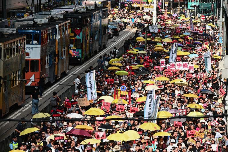 The demonstration comes just days after four prominent leaders of Hong Kong's democracy movement were jailed for their role in organising mass pro-democracy protests in 2014.