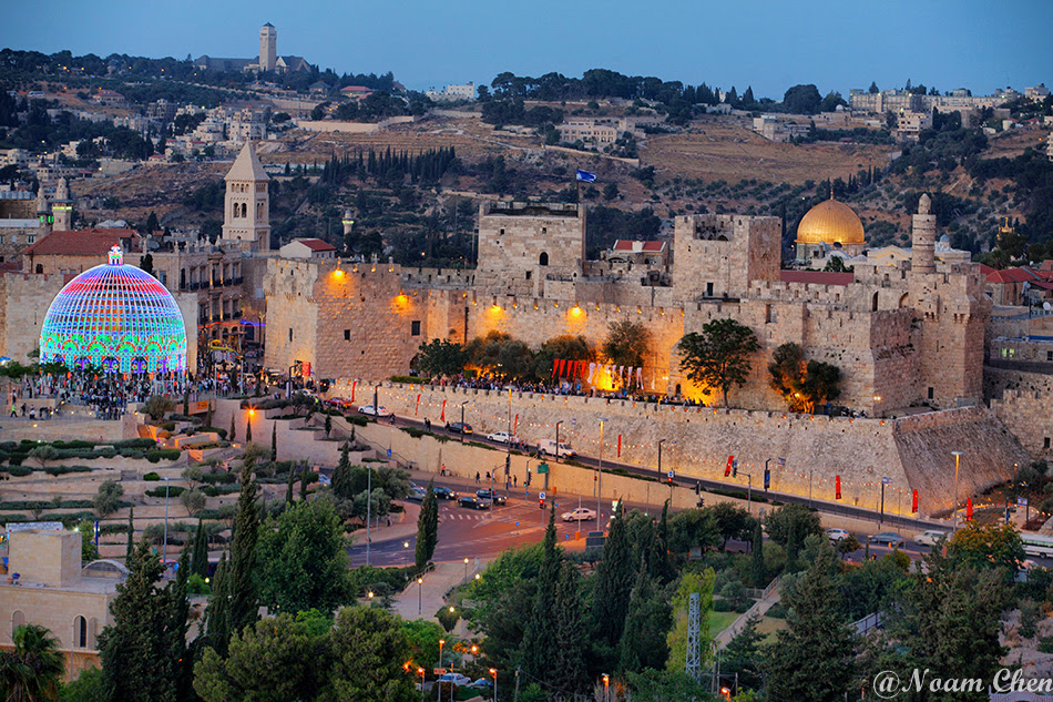 a bird-eye view of the old city of jerusalem during dusk