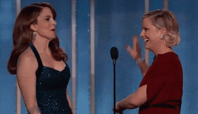 Tina Fey & Amy Poehler giving a high-five