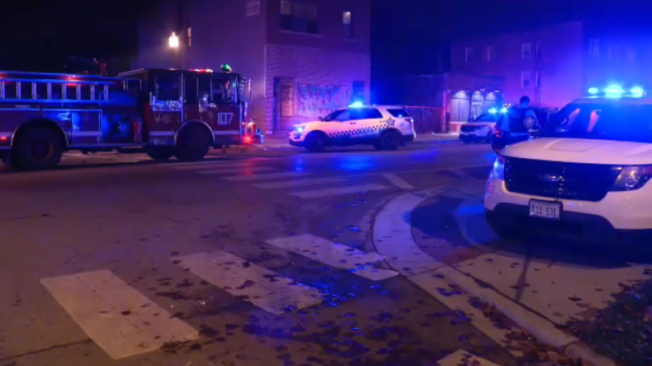 Chicago police vehicles at the scene of a mass shooting.