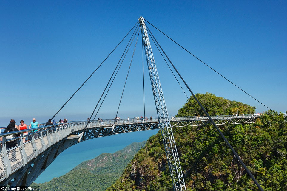 Completed in                                                      2004, the Langkawi                                                      Sky Bridge is                                                      built on top of                                                      the Machinchang                                                      mountain in                                                      Malaysia and hangs                                                      at about 328 ft                                                      above the ground.                                                      The walkway can                                                      accommodate up to                                                      250 people at the                                                      same time and                                                      swings out over                                                      the landscape to                                                      give visitors a                                                      unique look at the                                                      landscape