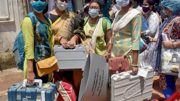  Woman Polling officials carry ballot boxes and other polling materials for their respective polling stations, for the 8th phase of West Bengal State Assembly Election, at Berhampore, in Murshidabad of West Bengal, Wednesday, April 28, 2021. 