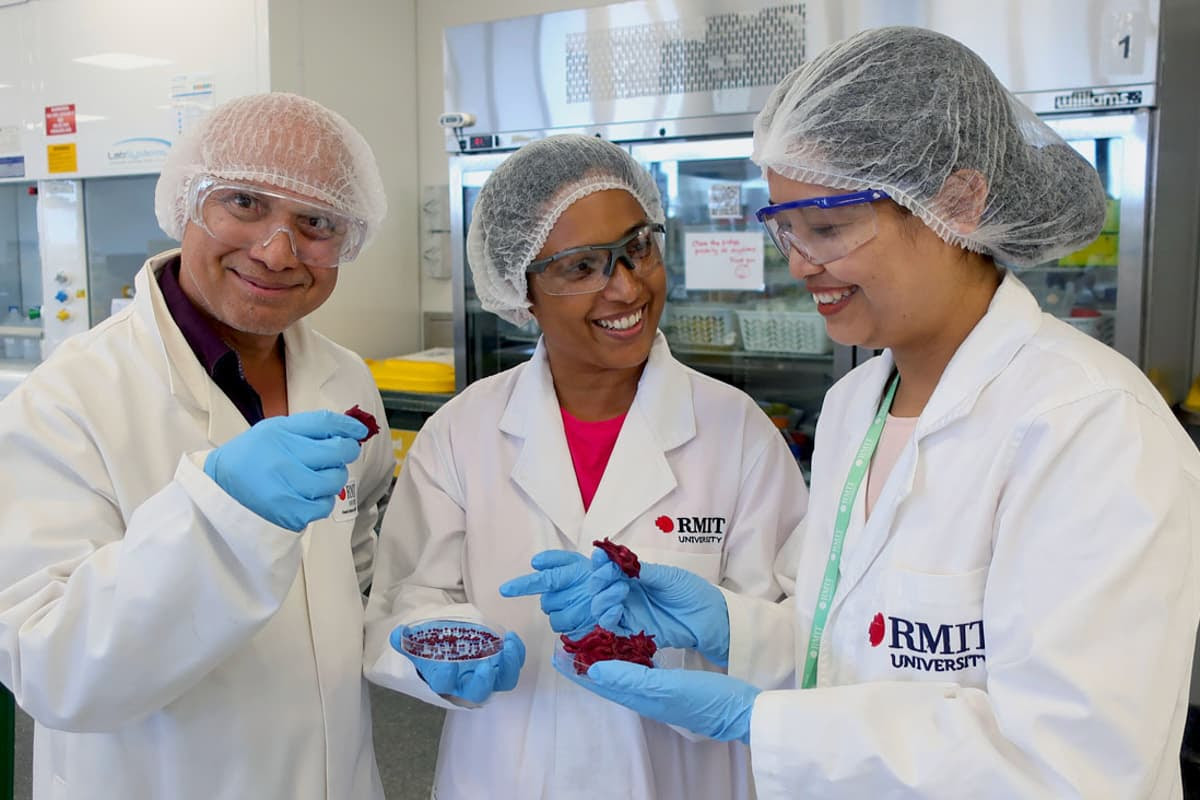 From left, Prof. Benu Adhikari, Dr. Thilini Thrimawithana and PhD candidate Manisha Singh, with roselle flower petals