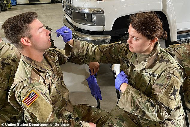 The military's number of COVID-19 rate is growing at twice the national rate seeing a 33 percent spike from July from July 1 to 10. The national case growth rate was 16 percent for that same time period. A medic with the Louisiana Army and Air National Guard conducts training at a COVID-19 drive thru testing center on March 18 in New Orleans