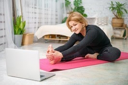 woman doing yoga exercise on the floor