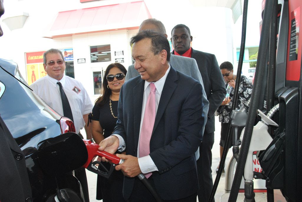 Minister of Energy Franklin Khan is the first to fill his tank during the opening of the NP El Socorro Service Station and Quickshoppe Plus in El Socorro, yesterday.