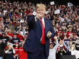 In this Jan. 9, 2020, file photo, President Donald Trump points as he arrives to speak at a campaign rally, in Toledo, Ohio. (AP Photo/ Jacquelyn Martin, File)
