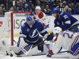 Montreal Canadiens center Eric Staal (21) and Tampa Bay Lightning center Brayden Point (21) reach for the puck next to Lightning goaltender Andrei Vasilevskiy (88) during the first period in Game 5 of the NHL hockey Stanley Cup finals, Wednesday, July 7, 2021, in Tampa, Fla. (AP Photo/Phelan Ebenhack)