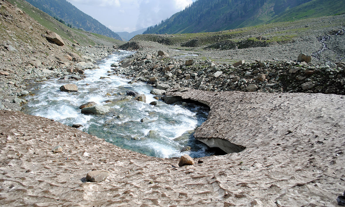 To the southeast of the Pir Panchal range lies the Kounsarnag  Lake surrounded by three peaks. It is fed by glaciers and is said to be a source of the Jhelum river. In the spring and summer, the water is some 40-ft higher than in winter. In the spring, the lake's surface is said to be covered with icebergs which are driven about by the wind. — Haziq Qadri