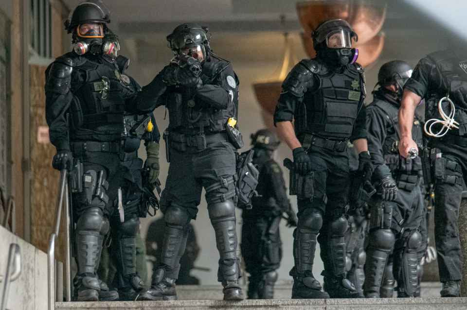 Police in riot gear Police in riot gear