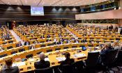 Photo of a committee meeting, European Parliament. A room full of people. 