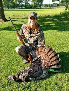 Michigan DNR's new natural resources deputy Shannon Hanna after a successful turkey hunt