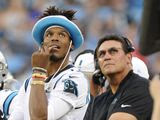 Carolina Panthers quarterback Cam Newton watches a replay with Carolina Panthers head coach Ron Rivera on the sidelines during the first half an NFL preseason football game against the Buffalo Bills, Friday, Aug. 16, 2019, in Charlotte, N.C. (AP Photo/Mike McCarn)