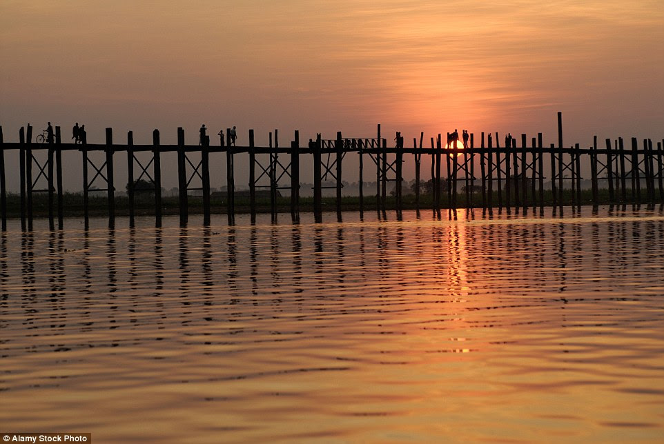 Spanning                                                      nearly a miles                                                      across the                                                      Taungthaman Lake                                                      in Myanmar, the                                                      U-Bein Bridge is a                                                      rickety platform                                                      made of teakwood.                                                      The bridge is held                                                      together on both                                                      sides with 1,086                                                      pillars that come                                                      up out of the                                                      water, and it                                                      looks like it                                                      could do with some                                                      extra support in                                                      places
